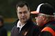 Baltimore Orioles executive vice president for baseball operations, Dan Duquette, left, talks with manager Buck Showalter as they watch a bullpen session on the second day of pitchers and catchers working out at the team's baseball spring training facility in Sarasota, Fla., Saturday, Feb. 15, 2014. The Orioles first full squad workout is set for Tuesday, Feb. 18. (AP Photo/Gene J. Puskar)