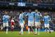 Manchester City's Yaya Toure, centre, celebrates with teammates after scoring his third goal against Fulham during their English Premier League soccer match at the Etihad Stadium, Manchester, England, Saturday March 22, 2014. (AP Photo/Jon Super)