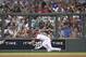 The Diamondbacks' outfielder Mark Trumbo can't get to a line drive from the Dodgers' Adrian Gonzalez during the Major League Baseball opening game between the Los Angeles Dodgers and Arizona Diamondbacks at the Sydney Cricket ground in Sydney, Saturday, March 22, 2014. (AP Photo/Rick Rycroft)
