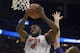 Florida center Patric Young (4) goes for the rebound as Albany forward Luke Devlin (11) defends during the first half in a second-round game in the NCAA college basketball tournament Thursday, March 20, 2014, in Orlando, Fla. (AP Photo/Phelan M. Ebenhack)