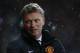 Manchester United's manager David Moyes looks on from the dugout before the start of their English Premier League soccer match against West Ham United at Upton Park, London, Saturday, March 22, 2014. (AP Photo/Sang Tan)