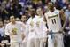 Wichita State forward Cleanthony Early (11) watches action against Cal Poly from the sideline during the second half of a second-round game in the NCAA college basketball tournament Friday, March 21, 2014, in St. Louis. (AP Photo/Charlie Riedel)
