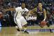 Mar 22, 2014; Buffalo, NY, USA; Connecticut Huskies guard Shabazz Napier (13) drives past Villanova Wildcats guard Tony Chennault (5) in the first half of a men's college basketball game during the third round of the 2014 NCAA Tournament at First Niagara Center. Mandatory Credit: Kevin Hoffman-USA TODAY Sports