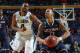 Villanova's Darrun Hilliard II (4) defends Connecticut's Shabazz Napier (13) during the second half of a third-round game in the NCAA men's college basketball tournament in Buffalo, N.Y., Saturday, March 22, 2014. (AP Photo/Bill Wippert)