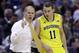 Michigan head coach John Beilein, left, talks to Michigan guard Nik Stauskas (11) in the first half of an NCAA college basketball game against Michigan State in the championship of the Big Ten Conference tournament on Sunday, March 16, 2014, in Indianapolis. (AP Photo/Michael Conroy)