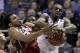 Kansas' Andrew Wiggins, right, and Stanford's Josh Huestis reach for a rebound during the first half of a third-round game of the NCAA college basketball tournament Sunday, March 23, 2014, in St. Louis. (AP Photo/Jeff Roberson)