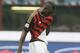AC Milan forward Mario Balotelli walks off the field at the end of a Serie A soccer match between AC Milan and Parma, at the San Siro stadium in Milan, Italy, Sunday, March 16, 2014. Parma won 4-2. (AP Photo/Luca Bruno)