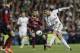 Real Madrid's Cristiano Ronaldo, right shoots on goal during a Spanish La Liga soccer match at the Santiago Bernabeu stadium in Madrid, Sunday March 23, 2014. (AP Photo/Paul White)