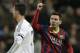 FC Barcelona's Lionel Messi from Argentina, right celebrates next to Real Madrid's Cristiano Ronaldo after scoring his team's 2nd goal during a Spanish La Liga soccer match at the Santiago Bernabeu stadium in Madrid, Sunday March 23, 2014. (AP Photo/Paul White)