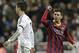 FC Barcelona's Lionel Messi from Argentina, right celebrates next to Real Madrid's Cristiano Ronaldo after scoring his team's 2nd goal during a Spanish La Liga soccer match at the Santiago Bernabeu stadium in Madrid, Sunday March 23, 2014. (AP Photo/Paul White)