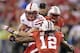 Nebraska running back Rex Burkhead protects the ball against Wisconsin defensive back Dezmen Southward (12) during the first half of the Big Ten championship NCAA college football game Saturday, Dec. 1, 2012, in Indianapolis. (AP Photo/Michael Conroy)