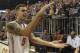 Florida guard Scottie Wilbekin (5) does the gator chomp as he leaves the court after Florida defeated LSU 79-61 in an NCAA college basketball game Saturday, March 1, 2014 in Gainesville, Fla. (AP Photo/Phil Sandlin)