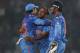 India's bowler Amit Mishra, center, celebrates with captain Mahendra Singh Dhoni, right, and teammate Rohit Sharma after taking the wicket of West Indies' batsman Dwayne Bravo during their ICC Twenty20 Cricket World Cup match in Dhaka, Bangladesh, Sunday, March 23, 2014. (AP Photo/Aijaz Rahi)