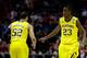 MILWAUKEE, WI - MARCH 22: Caris LeVert #23 of the Michigan Wolverines celebrates with teammate Jordan Morgan #52 after making a three point shot in the second half against the Texas Longhorns during the third round of the 2014 NCAA Men's Basketball Tournament at BMO Harris Bradley Center on March 22, 2014 in Milwaukee, Wisconsin. (Photo by Mike McGinnis/Getty Images)