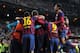 MADRID, SPAIN - MARCH 23: Lionel Messi of Barcelona is mobbed by team mates after scoring his team's fourth goal during the La Liga match between Real Madrid CF and FC Barcelona at the Bernabeu on March 23, 2014 in Madrid, Spain. (Photo by Denis Doyle/Getty Images)