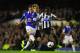 LIVERPOOL, ENGLAND - SEPTEMBER 30: Everton player Ross Barkley shoots past Mapou Yanga-Mbiiwa to score the second goal during the Barclays Premier League match between Everton and Newcastle United at Goodison Park on September 30, 2013 in Liverpool, England. (Photo by Stu Forster/Getty Images)