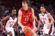 PORTLAND, OR - APRIL 7: Dario Saric #12 of the World Select Team drives against Shabazz Muhammad #10 and James Robinson #8 of the USA Junior Select Team during the 2012 Hoop Summit on April 7, 2012 at the Rose Garden Arena in Portland, Oregon. NOTE TO USER: User expressly acknowledges and agrees that, by downloading and or using this photograph, User is consenting to the terms and conditions of the Getty Images License Agreement. Mandatory Copyright Notice: Copyright 2012 NBAE (Photo by Sam Forencich/NBAE via Getty Images)