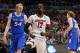 ORLANDO, FL - MARCH 22: Mangok Mathiang #12 of the Louisville Cardinals reacts in the first half after dunking the ball against the Saint Louis Billikens during the third round of the 2014 NCAA Men's Basketball Tournament at Amway Center on March 22, 2014 in Orlando, Florida. (Photo by Kevin C. Cox/Getty Images)