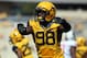 Sep 28, 2013; Morgantown, WV, USA; West Virginia Mountaineers defensive lineman Will Clarke (98) celebrates after a stop during the first half against the Oklahoma State Cowboys at Milan Puskar Stadium. Mandatory Credit: Peter Casey-USA TODAY Sports