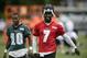 Jul 26, 2013; Philadelphia, PA, USA; Philadelphia Eagles quarterback Michael Vick (7) and wide receiver DeSean Jackson (10) walk off the field together at the end of practice during training camp at the Eagles NovaCare Complex. Mandatory Credit: Howard Smith-USA TODAY Sports