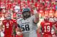 Utah State's Tyler Larsen (58) celebrates after his team scores in the second quarter during an NCAA football game against Utah Thursday, Aug. 29, 2013, in Salt Lake City. (AP Photo/Rick Bowmer)