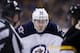 Winnipeg Jets' Mark Scheifele (55) waits for a face off in the third period of an NHL hockey game against the Boston Bruins in Boston, Saturday, Jan. 4, 2014. The Bruins won 4-1. (AP Photo/Michael Dwyer)