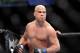 Tito Ortiz eyes his opponent, Forrest Griffin before his UFC 148 light heavyweight fight Saturday, July 7, 2012, in Las Vegas. Griffin won the bout by a unanimous decision. (AP Photo/David Becker)