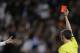 Real Madrid's Sergio Ramos, left disputes a red card shown to him by the referee for a foul on FC Barcelona's Neymar during a Spanish La Liga soccer match at the Santiago Bernabeu stadium in Madrid, Sunday March 23, 2014. (AP Photo/Paul White)