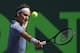KEY BISCAYNE, FL - MARCH 23: Roger Federer of Switzerland plays a backhand against Thiemo De Bakker of the Netherlands during their third round match during day 7 at the Sony Open at Crandon Park Tennis Center on March 23, 2014 in Key Biscayne, Florida. (Photo by Clive Brunskill/Getty Images)