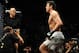Nov 16, 2013; Las Vegas, NV, USA; Chael Sonnen (blue gloves) walks towards the cage before his light heavyweight bout during UFC 167 at MGM Grand Garden Arena. Mandatory Credit: Stephen R. Sylvanie-USA TODAY Sports
