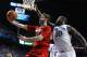 LEXINGTON, KY - DECEMBER 28: Luke Hancock #11 of the Louisville Cardinals shoots the ball while defended by Julius Randle #30 of the Kentucky Wildcats during the game at Rupp Arena on December 28, 2013 in Lexington, Kentucky. (Photo by Andy Lyons/Getty Images)