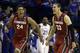 Stanford's Josh Huestis, left, and Dwight Powell, right, celebrate as Kansas' Tarik Black (25) watches in the background after in a third-round game of the NCAA college basketball tournament Sunday, March 23, 2014, in St. Louis. Stanford won 60-57. (AP Photo/Jeff Roberson)