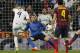 Real's Karim Benzema, left, scores a goal during a Spanish La Liga soccer match between Real Madrid and FC Barcelona at the Santiago Bernabeu stadium in Madrid, Spain, Sunday, March 23, 2014. (AP Photo/Andres Kudacki)