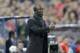 AC Milan coach Clarence Seedorf signals to his players during a Champions League, round of 16, second leg, soccer match between Atletico Madrid and AC Milan at the Vicente Calderon stadium in Madrid, Tuesday March 11, 2014. (AP Photo/Paul White)