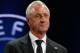 Former Netherlands player Johan Cruyff shows the name of Atletico Madrid, who will play Group G, during the UEFA Champions League draw in Monaco, Thursday, Aug. 29, 2013. (AP Photo/Claude Paris)