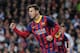 MADRID, SPAIN - MARCH 23: Lionel Messi of Barcelona celebrates scoring his team's third goal during the La Liga match between Real Madrid CF and FC Barcelona at the Bernabeu on March 23, 2014 in Madrid, Spain. (Photo by Denis Doyle/Getty Images)
