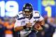 EAST RUTHERFORD, NJ - FEBRUARY 02: Quarterback Russell Wilson #3 of the Seattle Seahawks runs the ball against the Denver Broncos during Super Bowl XLVIII at MetLife Stadium on February 2, 2014 in East Rutherford, New Jersey. (Photo by Elsa/Getty Images)