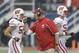Wisconsin head coach Gary Andersen praises his defense as they come off the field during the first half of the Capital One Bowl NCAA college football game in Orlando, Fla., Wednesday, Jan. 1, 2014.(AP Photo/John Raoux)