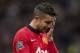 Manchester United's Robin van Persie wipes his face as he walks from the pitch after his team's 1-0 defeat to Newcastle in their English Premier League soccer match at Old Trafford Stadium, Manchester, England, Saturday Dec. 7, 2013. (AP Photo/Jon Super)
