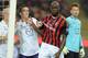 MILAN, ITALY - NOVEMBER 02: Mario Balotelli of AC Milan #45 and Gonzalo Rodriguez of ACF Fiorentina during the Serie A match between AC Milan and ACF Fiorentina at Stadio Giuseppe Meazza on November 2, 2013 in Milan, Italy. (Photo by Claudio Villa/Getty Images)