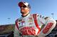 FONTANA, CA - MARCH 21: Dale Earnhardt Jr., driver of the #88 National Guard Chevrolet, stands on the grid during qualifying for the NASCAR Sprint Cup Series Auto Club 400 at Auto Club Speedway on March 21, 2014 in Fontana, California. (Photo by Jerry Markland/Getty Images)