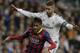 FC Barcelona's Neymar from Brazil, left is pressured by Real Madrid's Sergio Ramos during a Spanish La Liga soccer match at the Santiago Bernabeu stadium in Madrid, Sunday March 23, 2014. (AP Photo/Paul White)