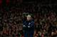 Arsenal's French manager Arsene Wenger stands with his arms folded during the English Premier League soccer match between Arsenal and Swansea City at the Emirates Stadium in London, Tuesday, March 25, 2014. (AP Photo/Matt Dunham)