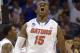Florida forward Will Yeguete (15) yells after scoring against Pittsburgh during the second half in a third-round game in the NCAA college basketball tournament Saturday, March 22, 2014, in Orlando, Fla. (AP Photo/Phelan M. Ebenhack)