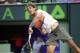 Rafael Nadal, of Spain, returns the ball to Denis Istomin, of Uzbekistan, during the Sony Open Tennis in Key Biscayne, Fla., Monday, March 24, 2014. Nadal won 6-1, 6-0. (AP Photo/J Pat Carter)