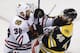 Chicago Blackhawks defenseman Michal Rozsival (32), of the Czech Republic, and Boston Bruins center David Krejci (46), of the Czech Republic, tangle during the third period in Game 6 of the NHL hockey Stanley Cup Finals, Monday, June 24, 2013, in Boston. (AP Photo/Charles Krupa)