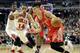 Houston Rockets guard Jeremy Lin (7) drives to the basket as Chicago Bulls guard D.J. Augustin (14) guards during the first half of an NBA basketball game in Chicago on Thursday, March 13, 2014. (AP Photo/Nam Y. Huh)