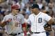 Los Angeles Angels' Mike Trout (27) talks to Detroit Tigers third baseman Miguel Cabrera after advancing to third base on an Albert Pujols fly out in the third inning of a baseball game in Detroit, Tuesday, June 25, 2013. (AP Photo/Paul Sancya)