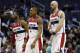 Feb 25, 2014; Washington, DC, USA; Washington Wizards point guard John Wall (2), Wizards shooting guard Bradley Beal (3), and Wizards center Marcin Gortat (4) walk off the court during a stoppage in play against the Orlando Magic in the fourth quarter at Verizon Center. The Wizards won 115-106. Mandatory Credit: Geoff Burke-USA TODAY Sports