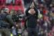 Liverpool's manager Brendan Rodgers applauds supporters after his team's 3-0 win against Manchester United in their English Premier League soccer match at Old Trafford Stadium, Manchester, England, Sunday March 16, 2014. (AP Photo/Jon Super)